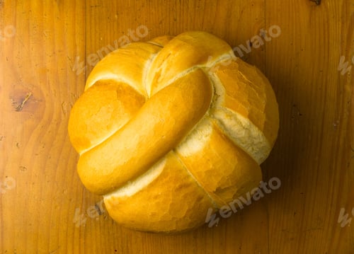 Preview: Fresh Braided Loaf Of White Wheat Bread On Wooden Background