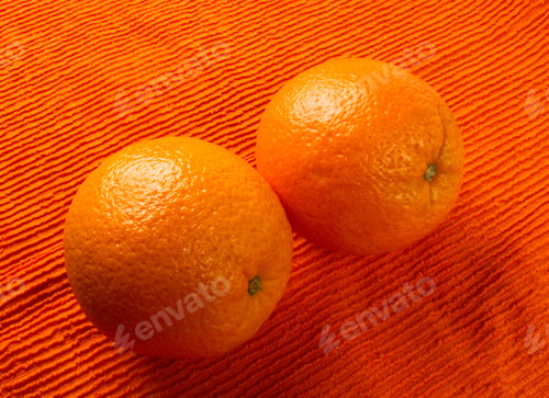 Preview: Two Orange On The Textile Orange Background