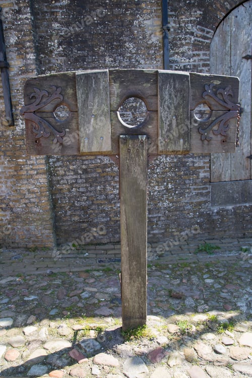 Preview: Typical Dutch Historic Fortified City With Touristic Street Furniture, Scaffold And Pillory From