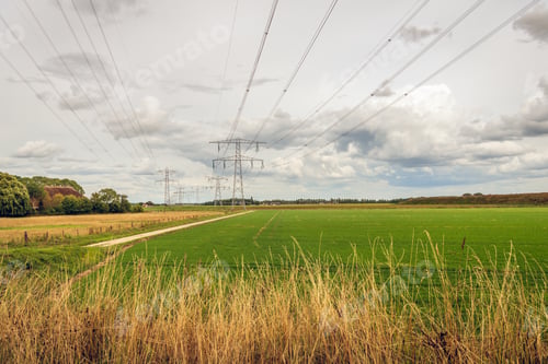 Preview: Dutch Polder Landscape With High Voltages Lines And Power Pylons. The Photo Was Taken Near The