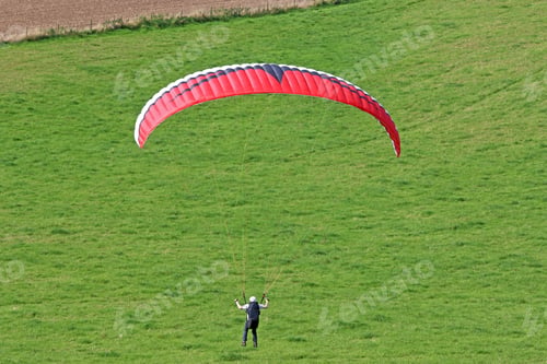 Preview: Paraglider Launching Wing On A Hill