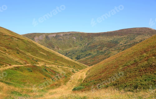 Preview: Morning Landscape With Green Mountains Under Blue Sky