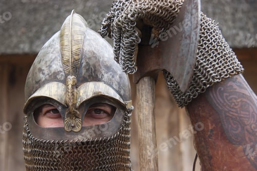 Preview: Re-Enactor Playing Medieval Warrior Wearing Chain Mail With Helmet And Holding Big Axe And