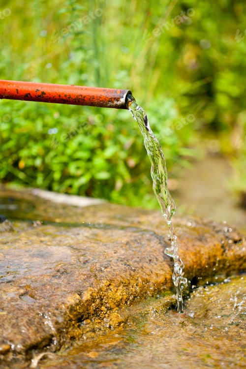 Preview: Closeup Of A Rusty Old Water Sprinkler In The Countryside