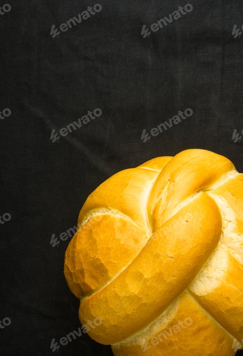 Preview: Fresh Braided Loaf Of White Wheat Bread On Black Background
