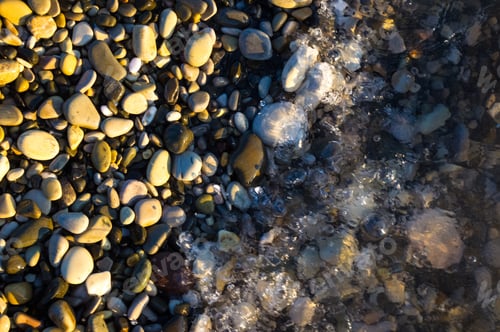Preview: Sea Pebble Beach With Multicoloured Stones, Transparent Waves With Foam, On A Warm Summer Day