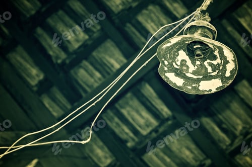 Preview: Old Lamp Hanging From A Wooden Ceiling.