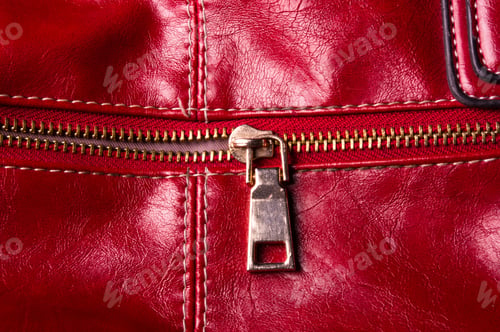 Preview: Closeup Of Buckles, Clasps, Zippers, Pockets, Fasteners, Fittings And Seams On The Red Hand Bag