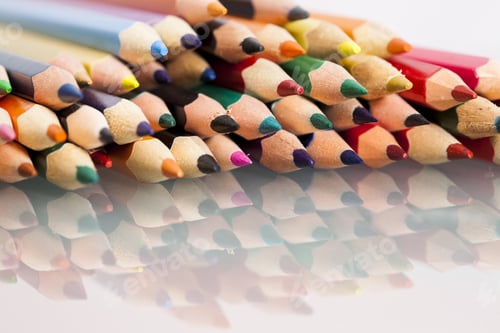 Preview: Group Of Sharp Colored Pencils With White Background And Reflexions