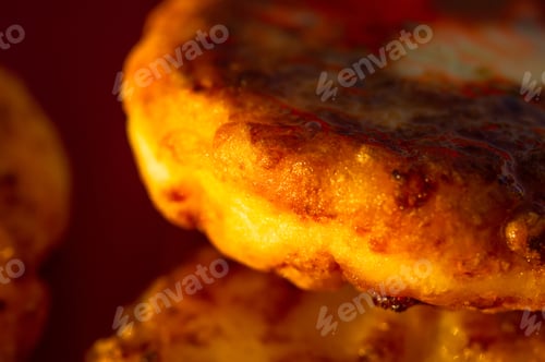 Preview: Fried Cheesecake Drizzled With Fresh Honey On A Red Plate, Macro Photo