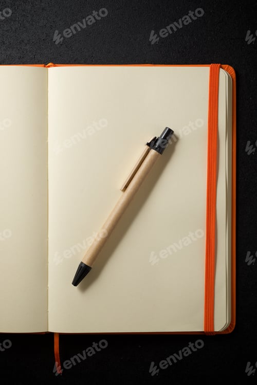 Preview: Notebook View On A Black Table.