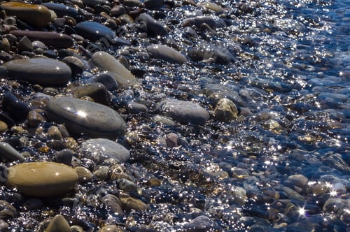 Preview: Sea Pebble Beach With Multicoloured Stones, Transparent Waves With Foam, On A Warm Summer Day