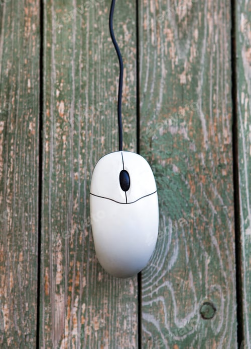 Preview: Old Computer Mouse Hanging On The Old Planks Background Closeup