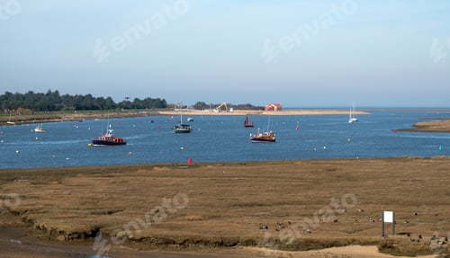 Preview: Small Boats Moored In A Tidal Estuary Creek, Norfolk, East Anglia, Uk