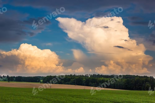 Preview: Summer Evening Landscape With Field And Dramatic Clouds
