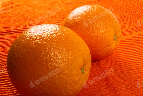 Preview: Two Orange On The Textile Orange Background
