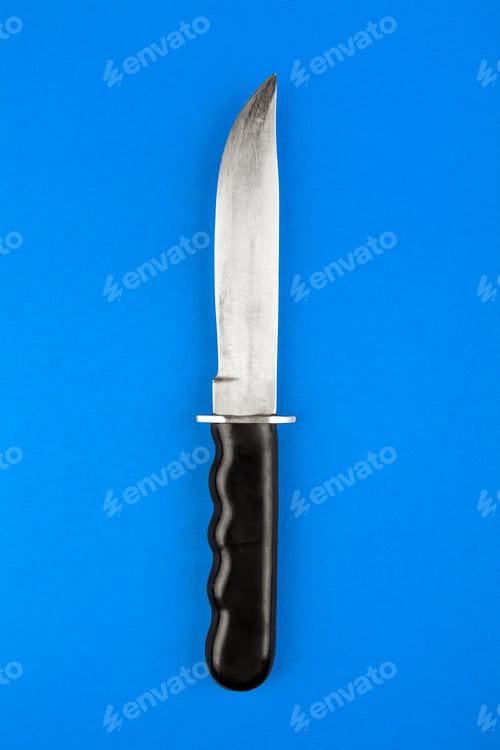 Preview: Knife On The Blue Paper Background Closeup