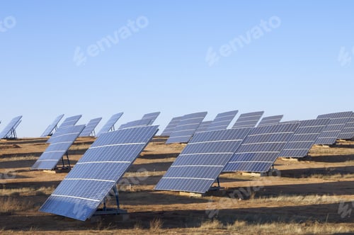 Preview: Group Of Large Photovoltaic Panels With Clear Blue Sky