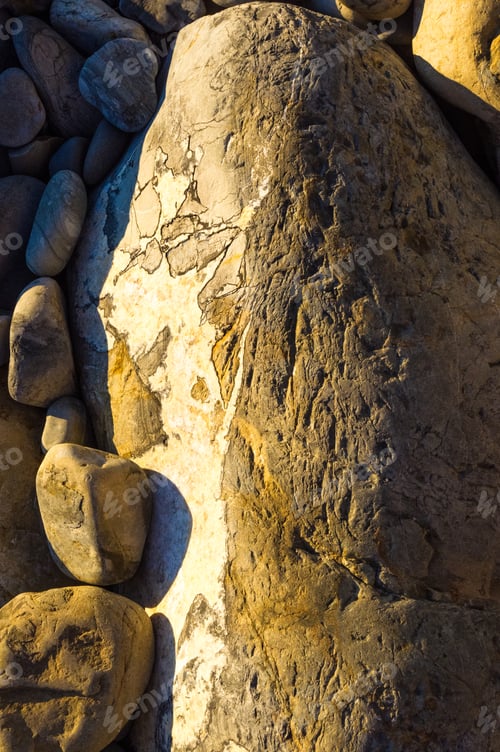 Preview: Boulders And Colorful Pebbles On The Beach