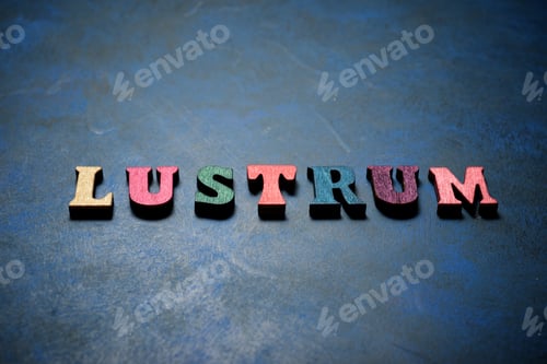 Preview: Lustrum Word On A Blue Table.