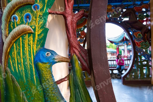 Preview: Peacock Motif Of Wooden Carved Decoration Of Pavilions Within The Green Lake Park Of Kunming City