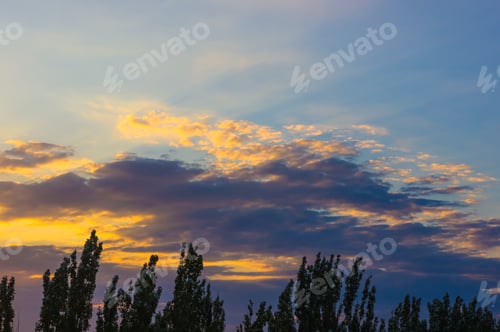 Preview: Landscape With Dramatic Light - Orange Clouds And The Outline Of Trees At Sunset