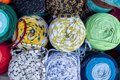 Preview: Rolled Stylish Comfort And Colourful Blankets Stored On Top Of Each Other. Rolled Blankets In A