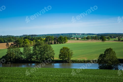 Preview: Green Field, River And Blue Sky