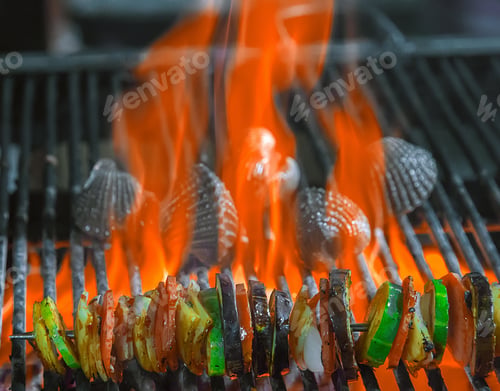 Preview: Vegetables Mix Cooked Spicy Skewers Kebab On The Bbq. Background Grill Grid With Fire Flames