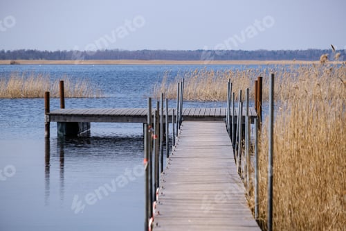 Preview: Wooden Plank Foothpath Boardwalk Trampoline In The Lake With Blue Water In Summer