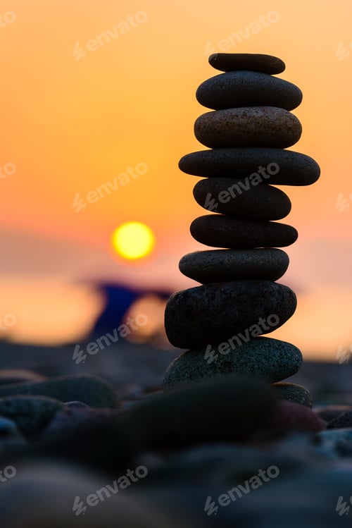 Preview: Stones Pyramid On Sand Symbolizing Zen, Harmony, Balance. Black Sea At Sunset In The Background.