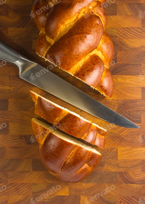 Preview: Chunks Large Braided Loaf With Knife On Wooden Background