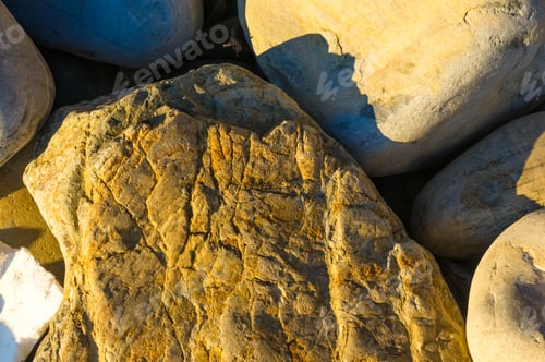 Preview: Boulders And Colorful Pebbles On The Beach