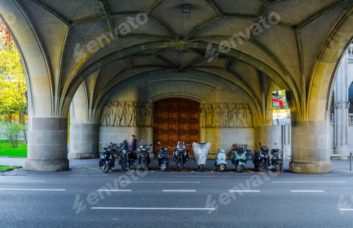 Preview: Various Motorcycles Parking Under A Bridge Next To The Urania Building In The Swiss City Zurich