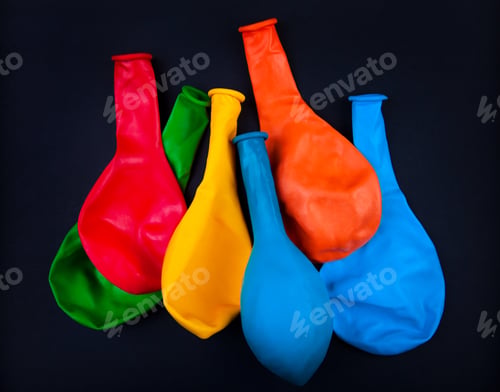 Preview: Unused Party Balloons On The Black Background Closeup