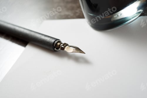Preview: Nib Pen For Calligraphy And Inkwell On A Table.