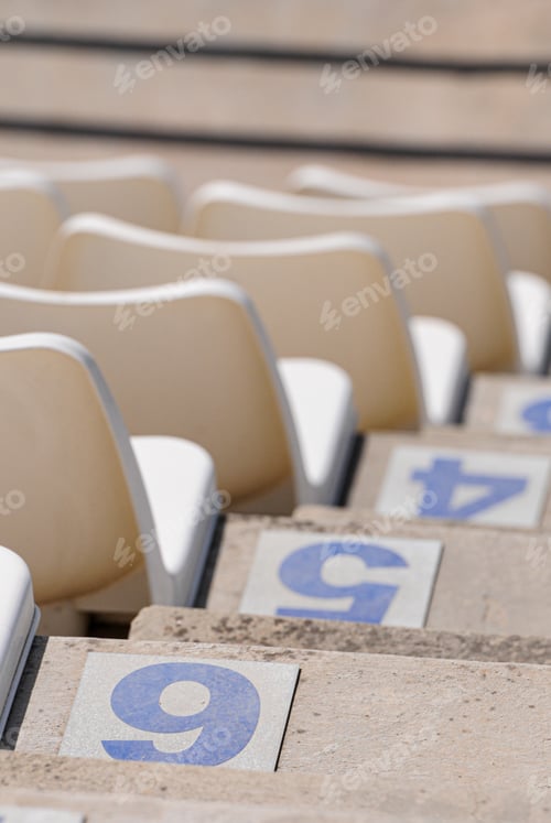Preview: White Plastic Empty Stadium Or Stage Chairs In A Row And Numbered Steps. Empty Stadium