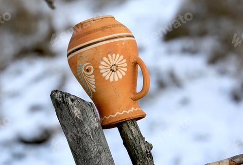 Preview: Traditional Ukrainian Clay Jug On A Wooden Fence