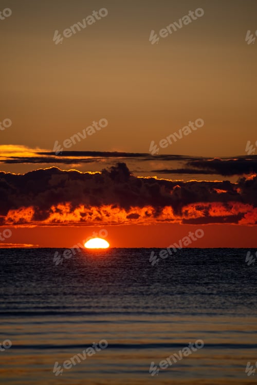 Preview: Colorful Sunset Or Sunrise In The Sea With Bright Colors And Dramatic Clouds And Fisherman Boats