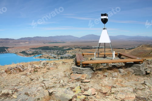 Preview: Geodetic Survey Marker At Mount John, Canterbury, New Zealand. Lake Tekapo Visible On The Left.
