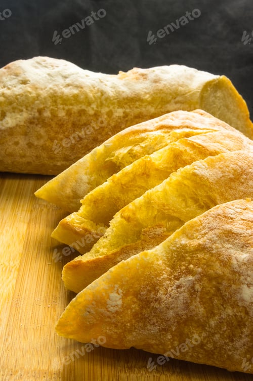 Preview: Fresh Sliced Loaf Of White Wheat Bread On Wooden Background