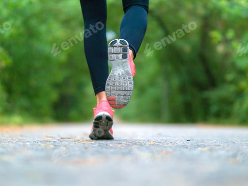 Preview: Running Woman In The Forest. Close-Up Of Sneakers. Helathy Lifestyle Concept.