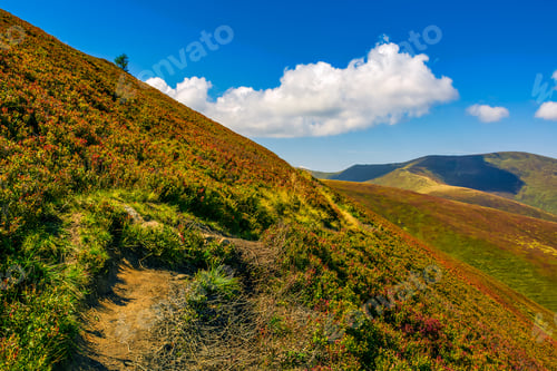 Preview: Summer Mountain Landscape. Path Through The Ridge To The Top Peak. Big Fluffy Clouds In A Blue Sky