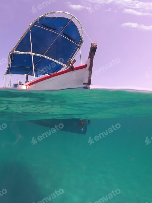 Preview: Underwater Split Photo Of Traditional Wooden Fishing Boat In Aegean Island, With Emerald Clear Sea