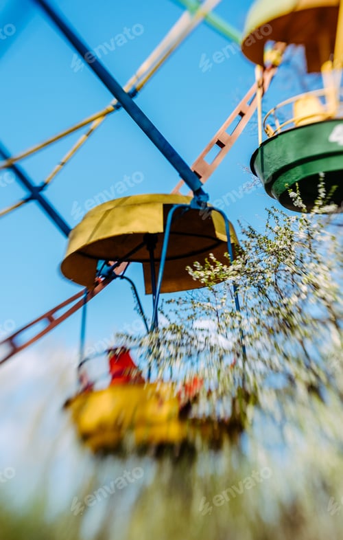 Preview: Blue Sky And Colorful Ferris Wheel In The Spring Park