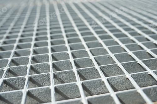 Preview: Close-Up Of A Gray Metal Grating.