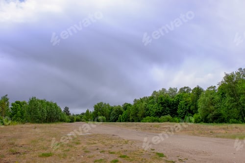 Preview: Empty Gravel Road With Tracks Of Mud In The Countryside In Summer Heat Perspective In Forest