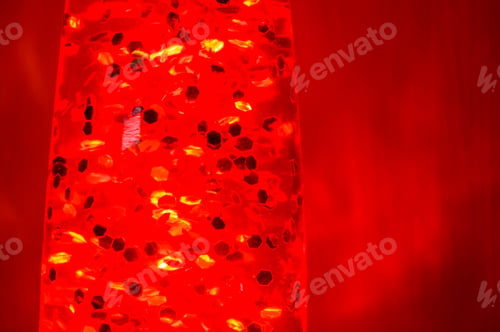 Preview: Orange Lava Lamp With Bright Stars At Night On A Red Background
