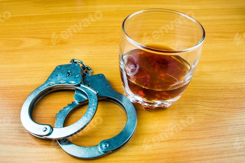 Preview: Handcuffs And A Whiskey On The Table Closeup