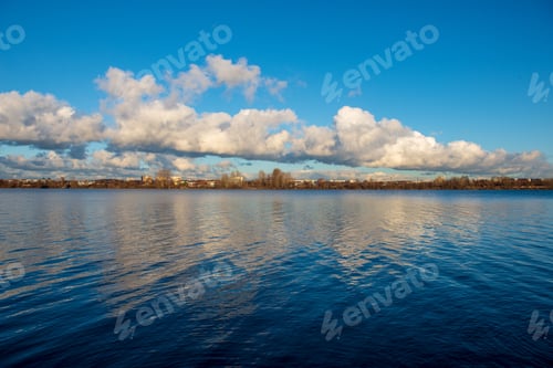 Preview: Reflections Of Shore Trees In The Calm Water Of A Lake In Countryside